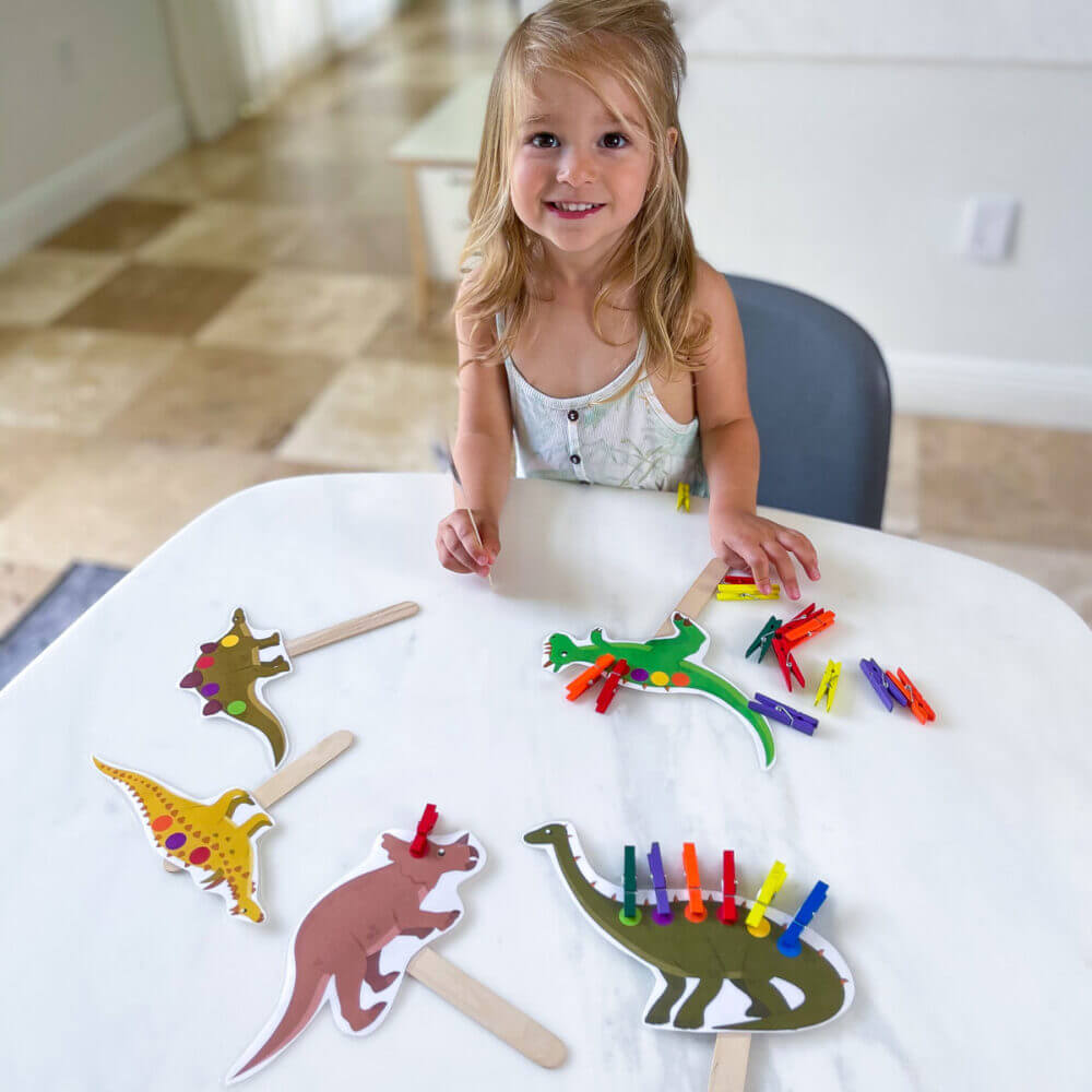 dinosaur activity with clothespins pegs for fine motor skills color matching and number learning free printable