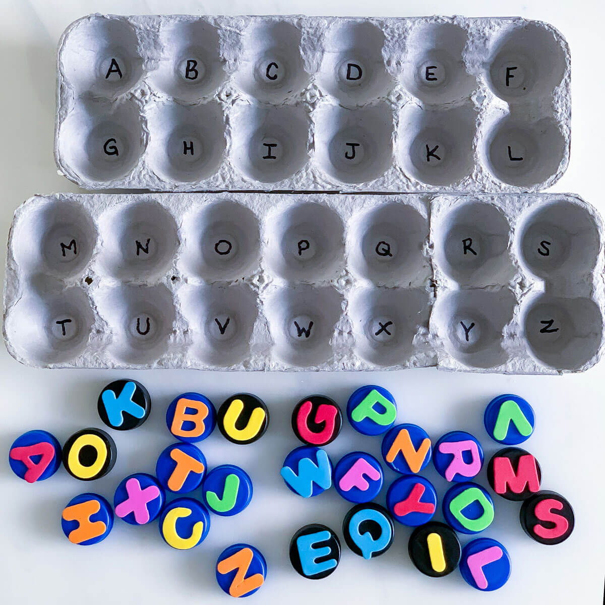 matching letter game using recycled egg carton bottle cap diy alphabet puzzle