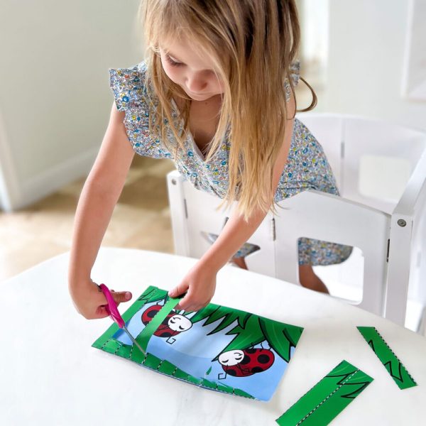 Make cutting practice for preschoolers fun with this activity! Kids will cut away the top layer of paper to reveal a picture underneath!