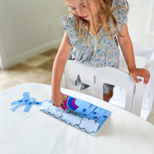 Make cutting practice for preschoolers fun with this activity! Kids will cut away the top layer of paper to reveal a picture underneath!