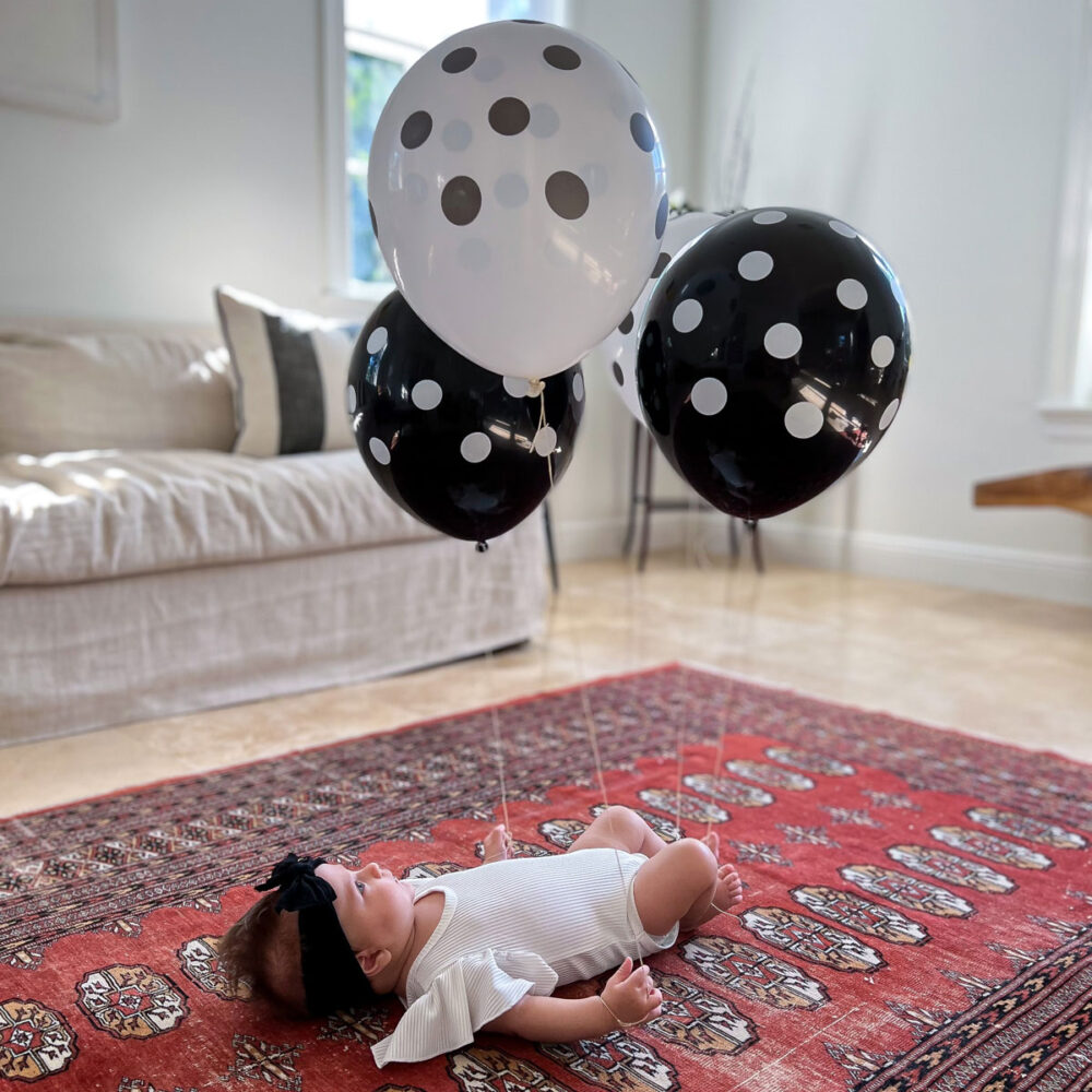 baby activity at 3 months balloon kicking