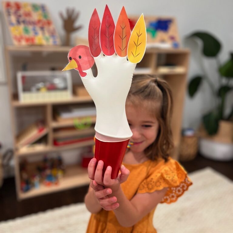 A printable Thanksgiving activity sheet on a table with crayons