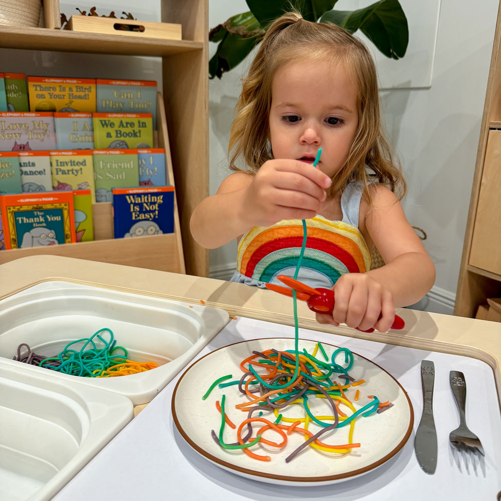spaghetti sensory play scissor skills rainbow pasta sensory table