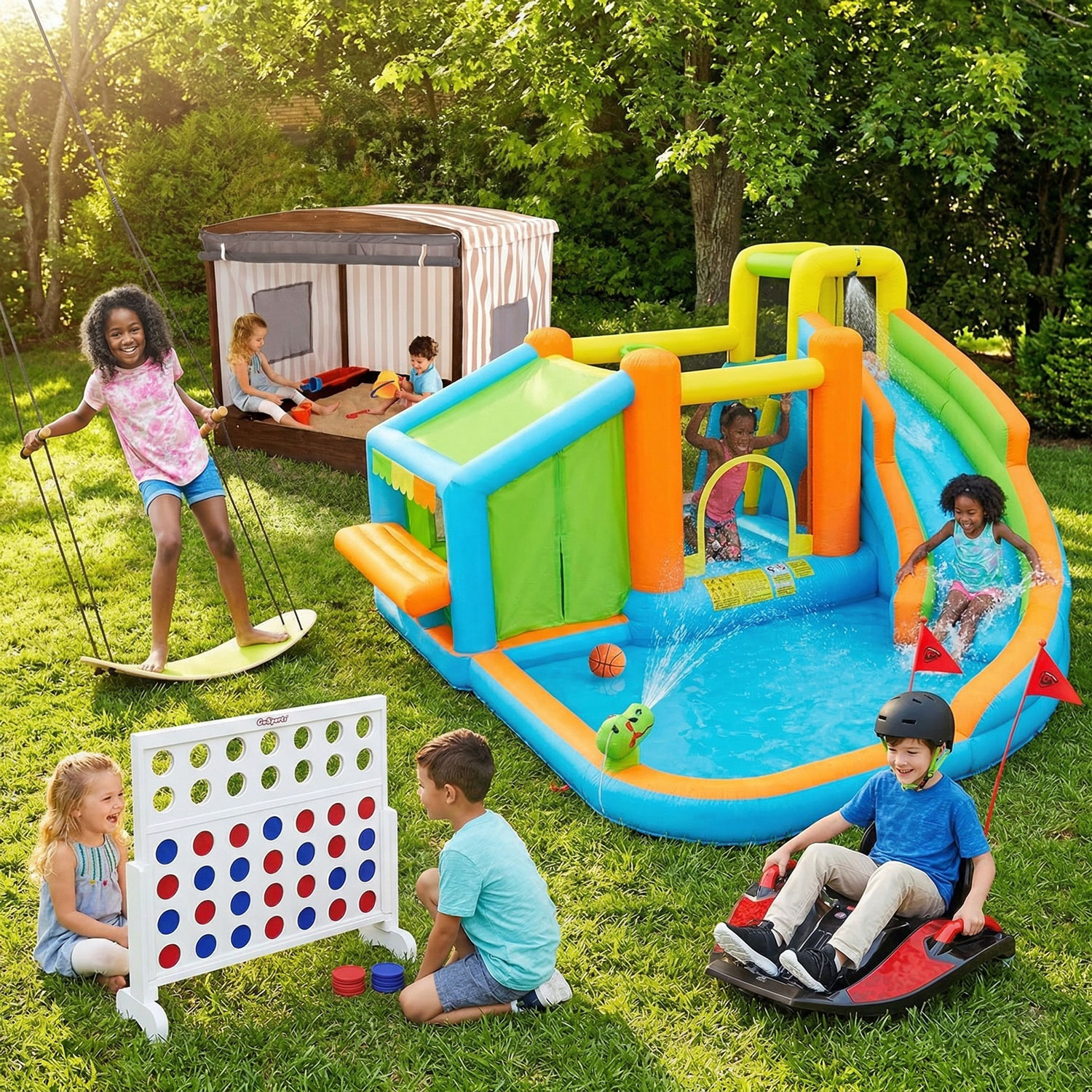 Kids playing outside in a backyard with an inflatable water slide, swing, sandbox, ride-on toy, and connect four game